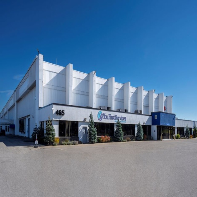 Exterior photo of 485 Cayuga showing a white building with a blue sky.